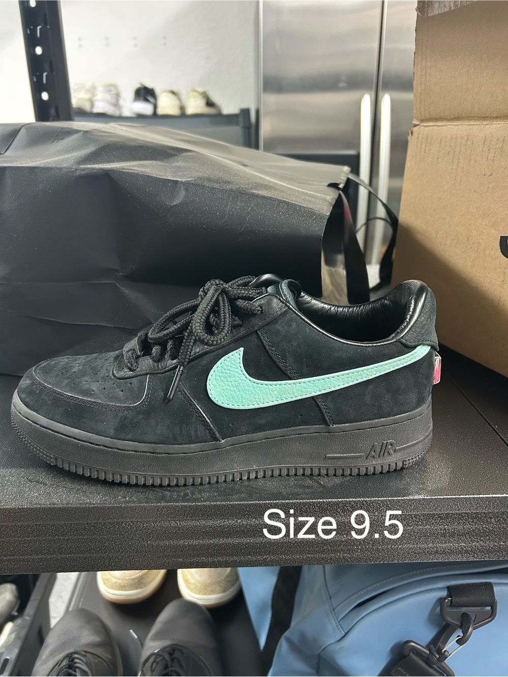 Nike Low-Top Sneaker in Black with Teal Swoosh